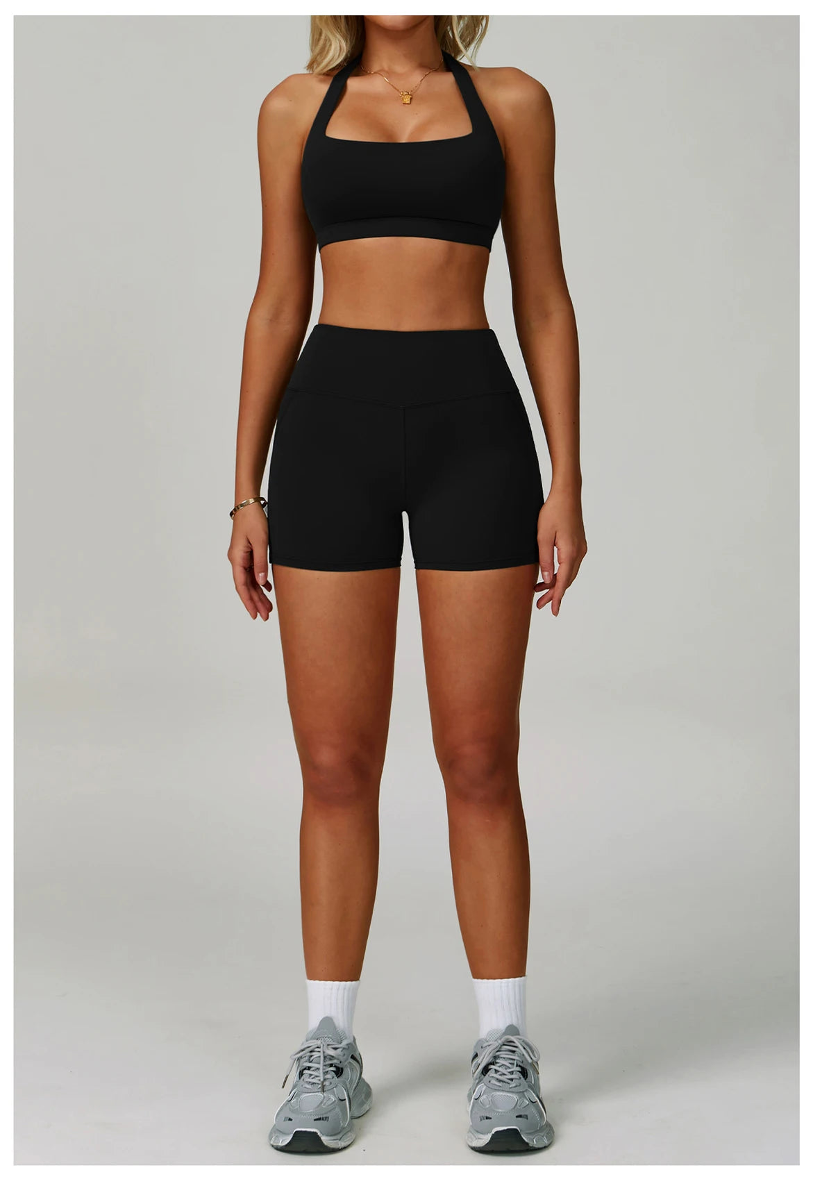 Black halter sports bra and high-waist active shorts set