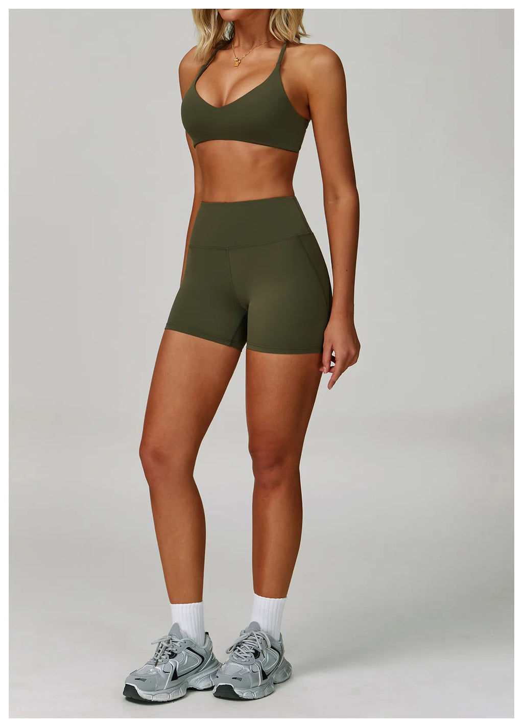 Olive halter sports bra and matching active shorts, mid-thigh coverage
