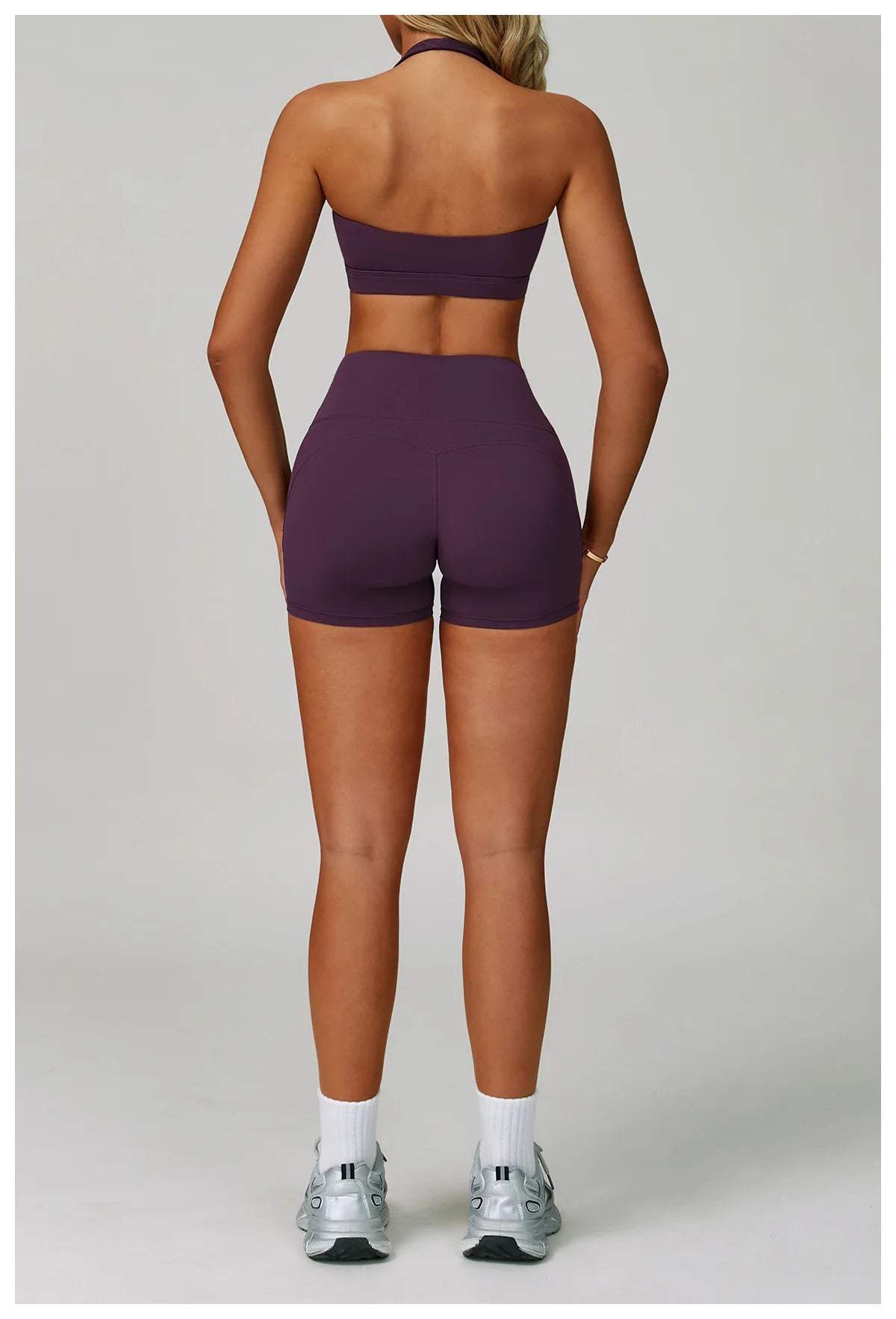 Plum purple halter sports bra and active shorts set, back view