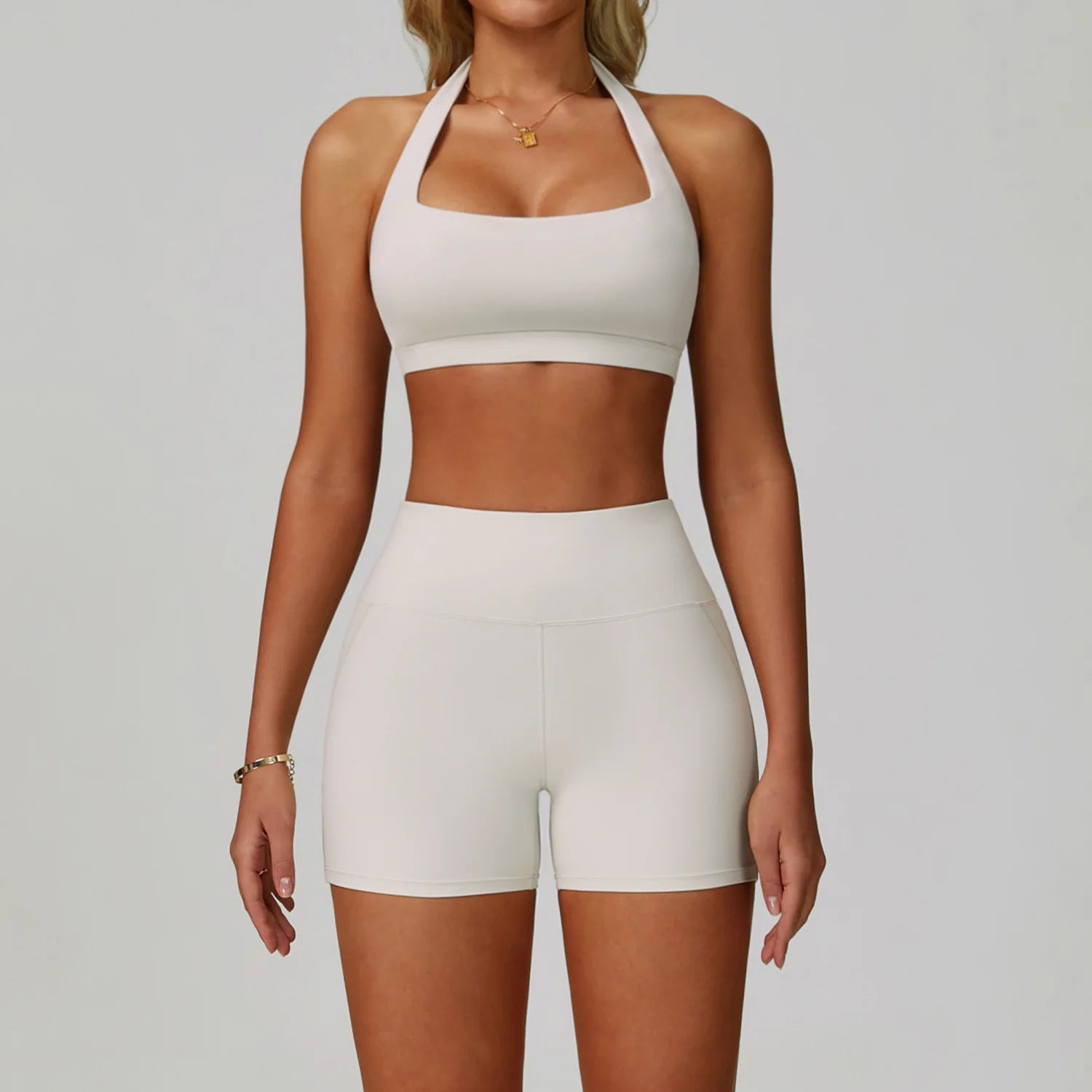 White halter sports bra and matching high-waist active shorts set