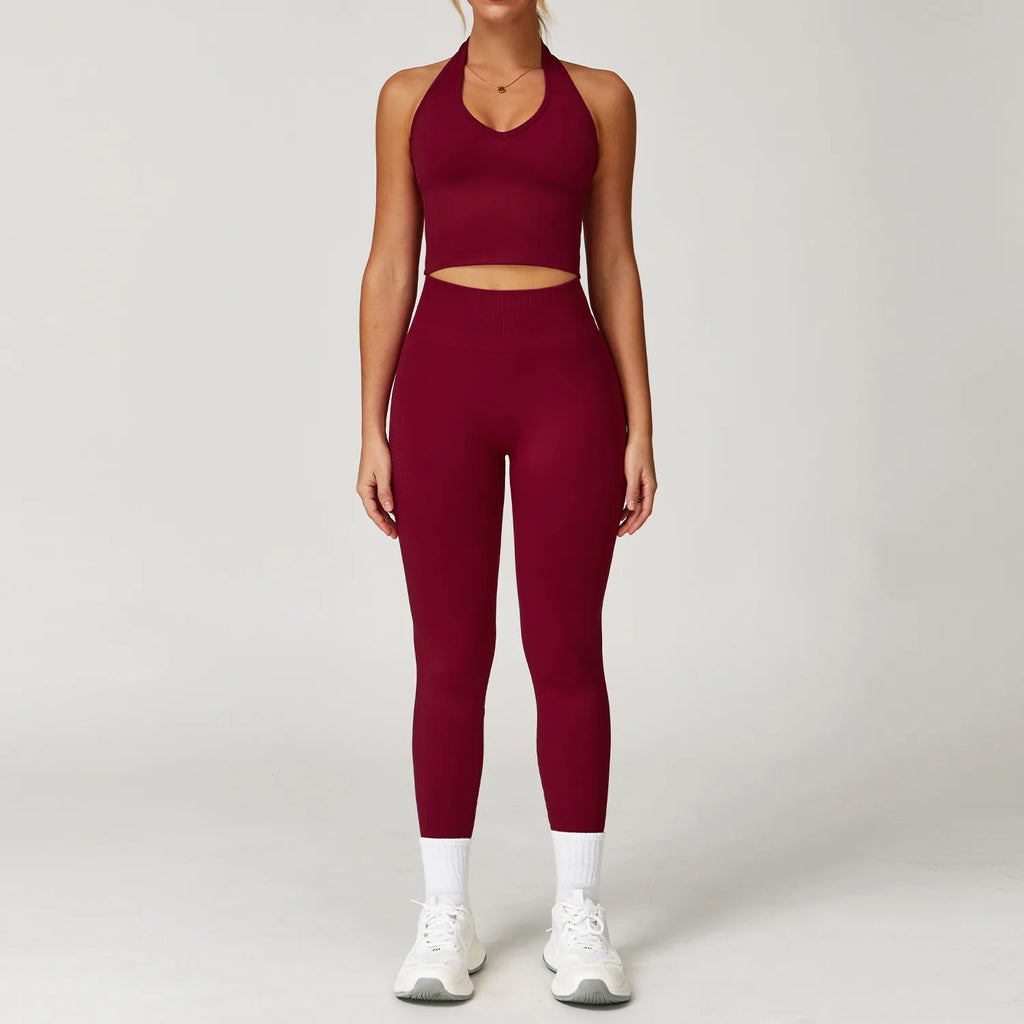 Matching sports tank top and active leggings set, maroon, studio front view