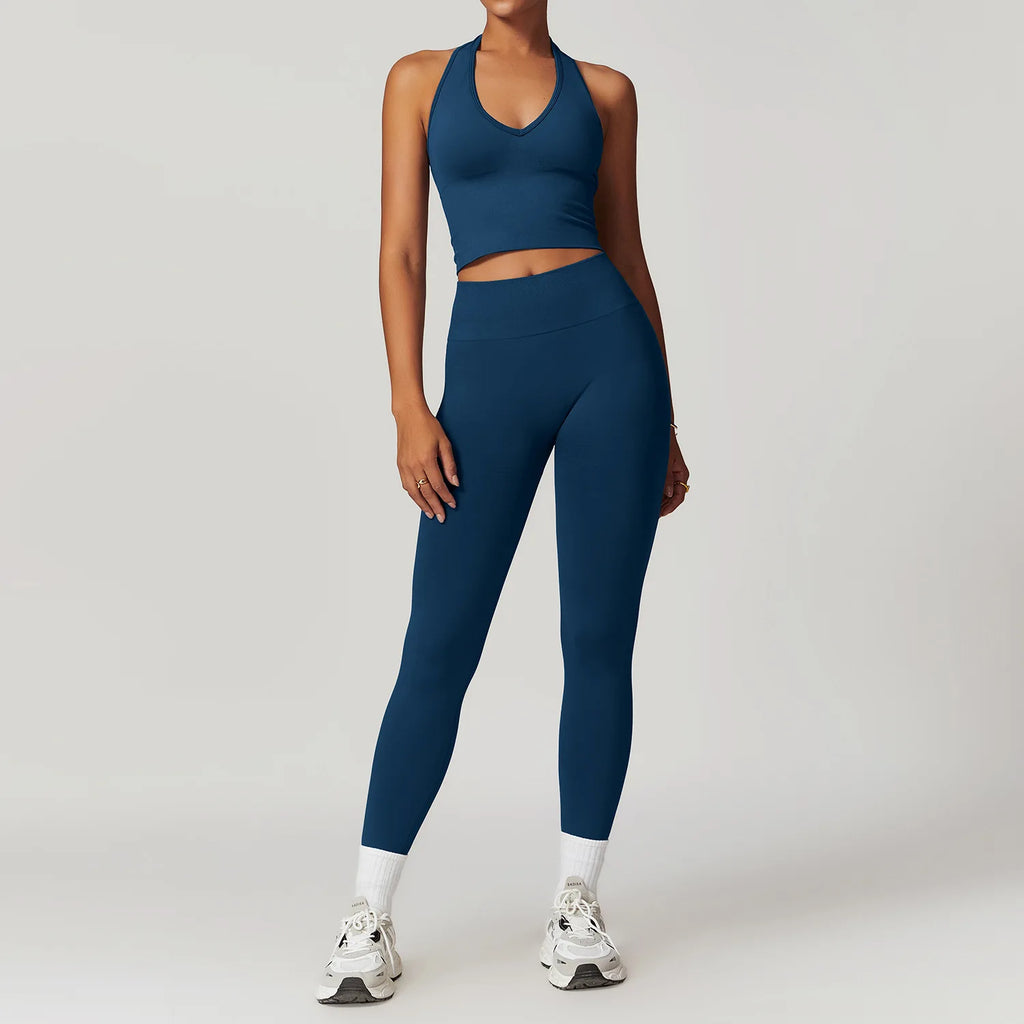 Dark blue halter crop tank and high-waist active leggings set, front view