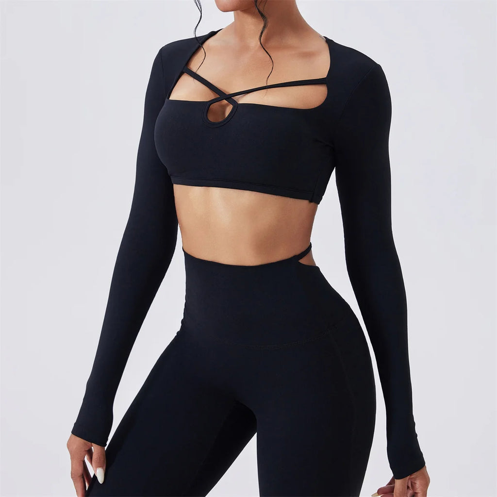 Hourglass Harmony Set in Black: close-up of long sleeve crop top with front strap cutout