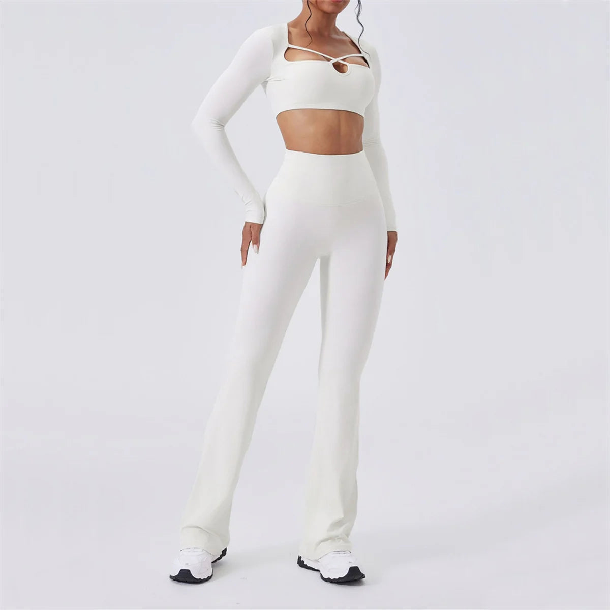 Hourglass Harmony Set in White: long sleeve crop top with chest cutout strap, flared pants