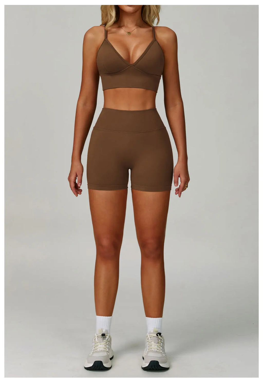 Xooie Fit women's matching activewear set in brown, featuring a bra top and high-waisted shorts