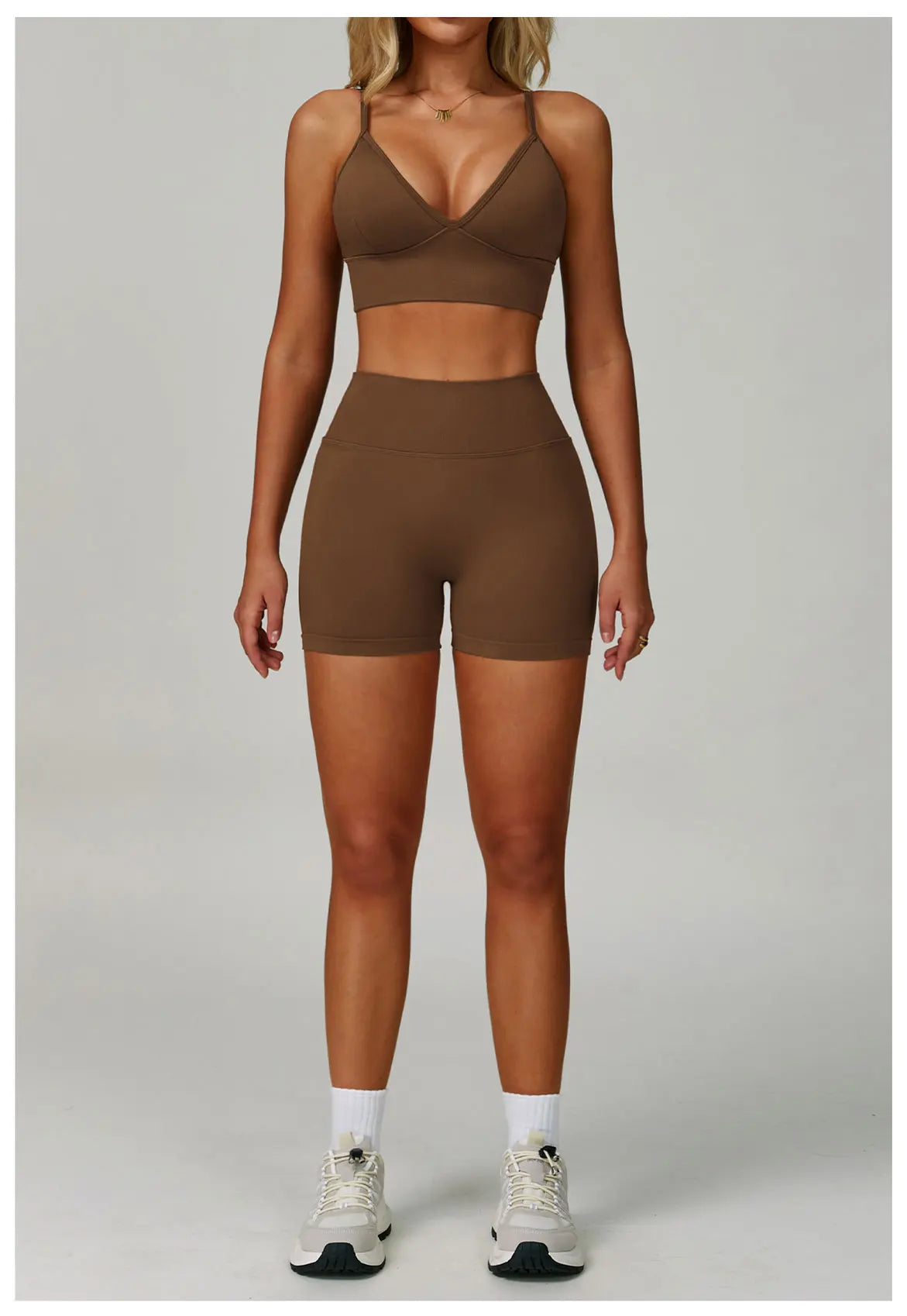 Xooie Fit women's matching activewear set in brown, featuring a bra top and high-waisted shorts
