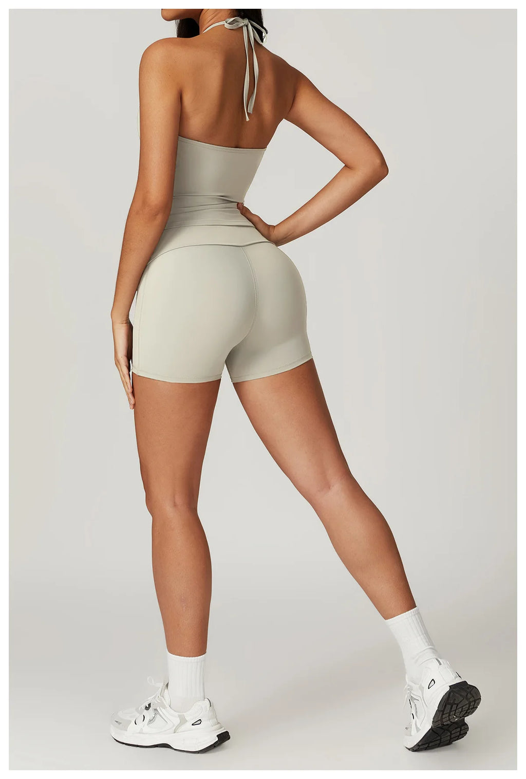 Xooie Fit women's matching activewear set in light gray with a fitted top and shorts