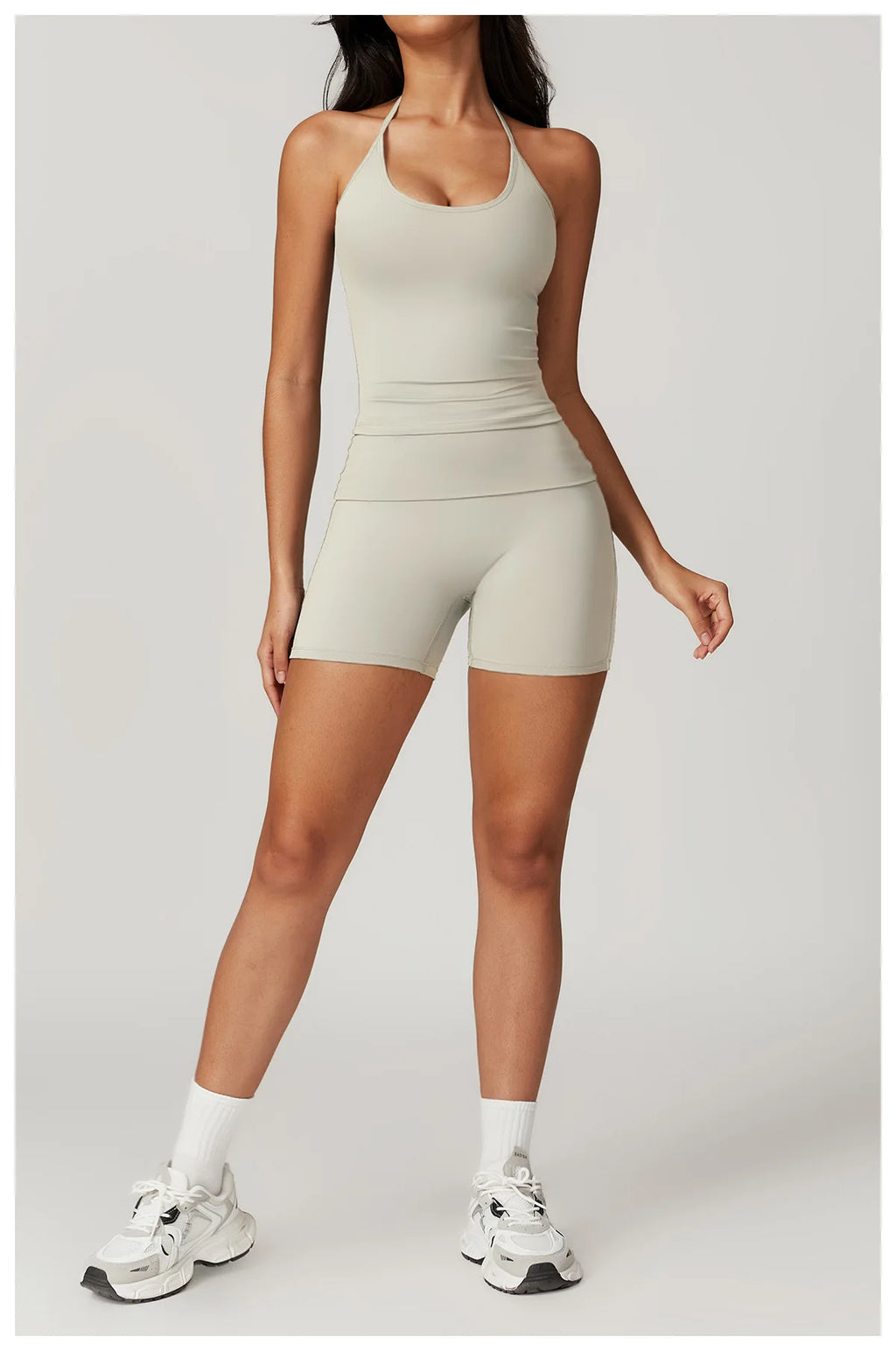 Xooie Fit women's matching activewear set in light gray featuring a crop top and shorts