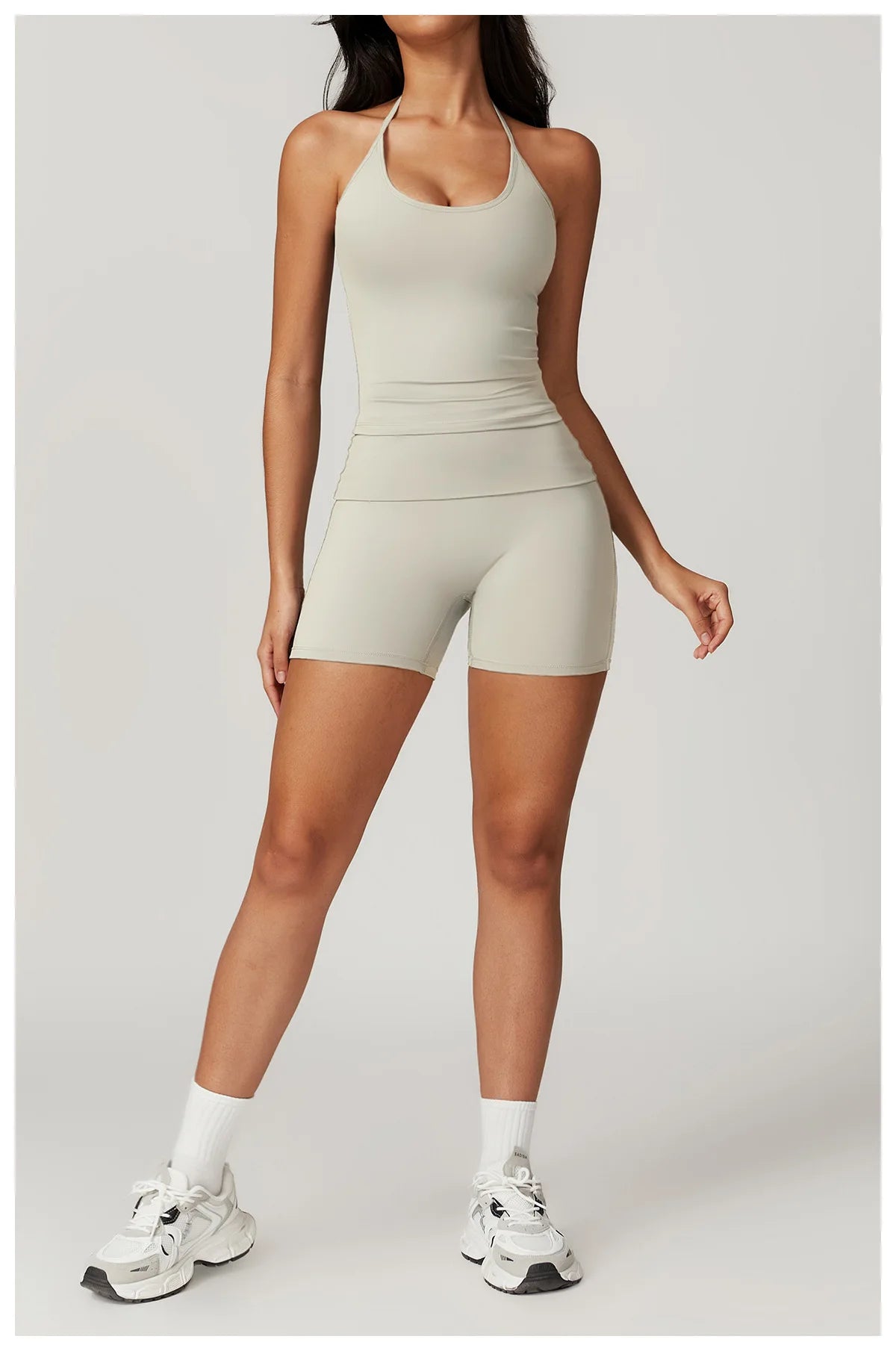 Xooie Fit women's matching activewear set in light gray featuring a crop top and shorts