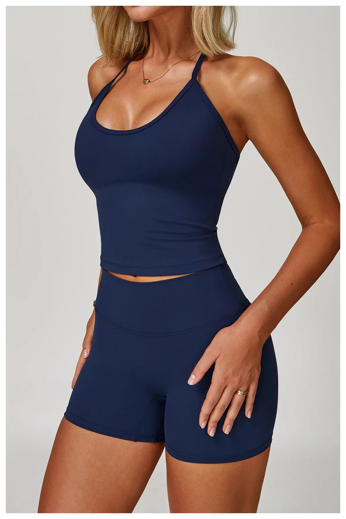 Xooie Fit women's matching activewear set in navy with a fitted tank top and high-waisted shorts