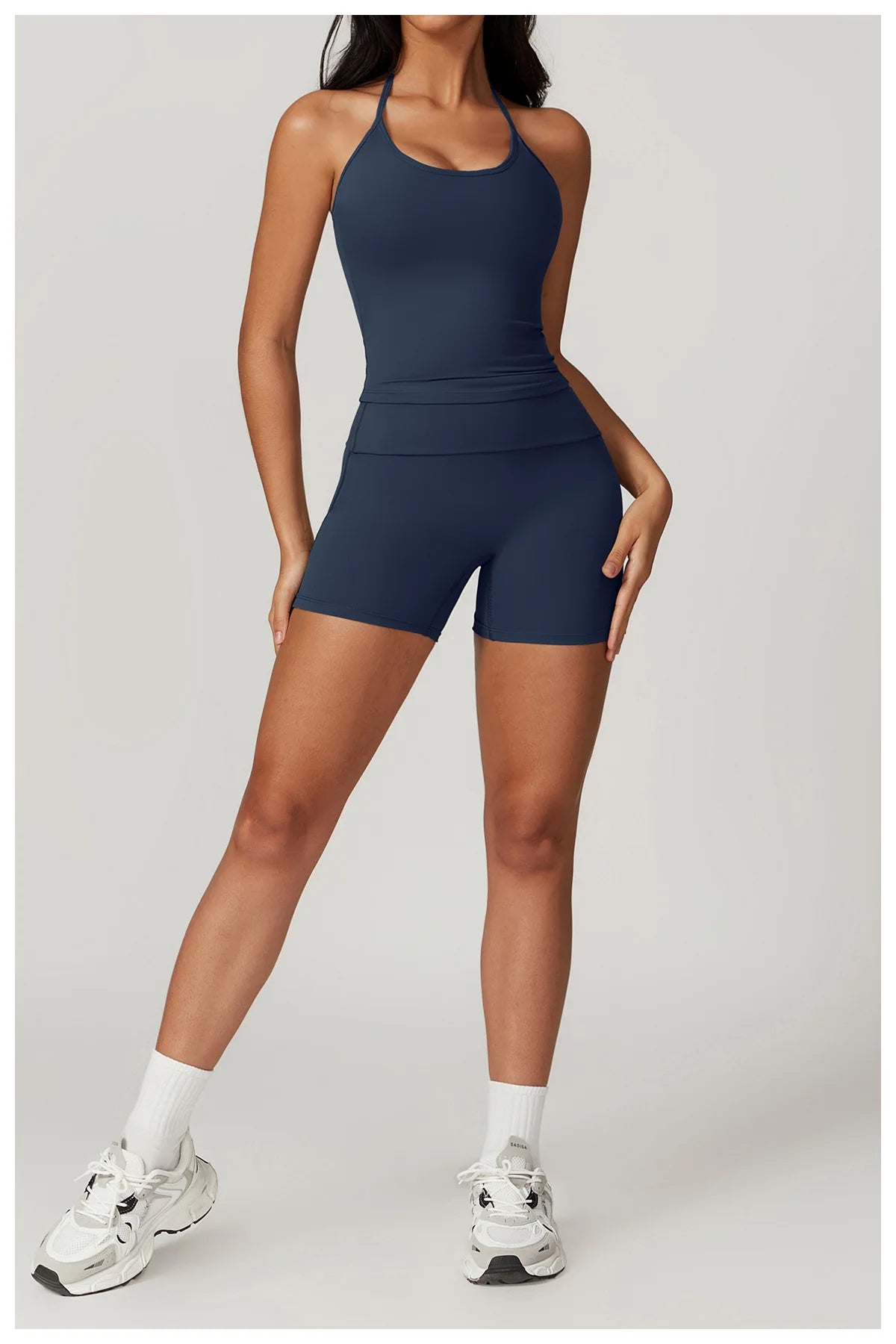 Xooie Fit women's matching activewear set in navy featuring a sleek tank top and shorts for workouts