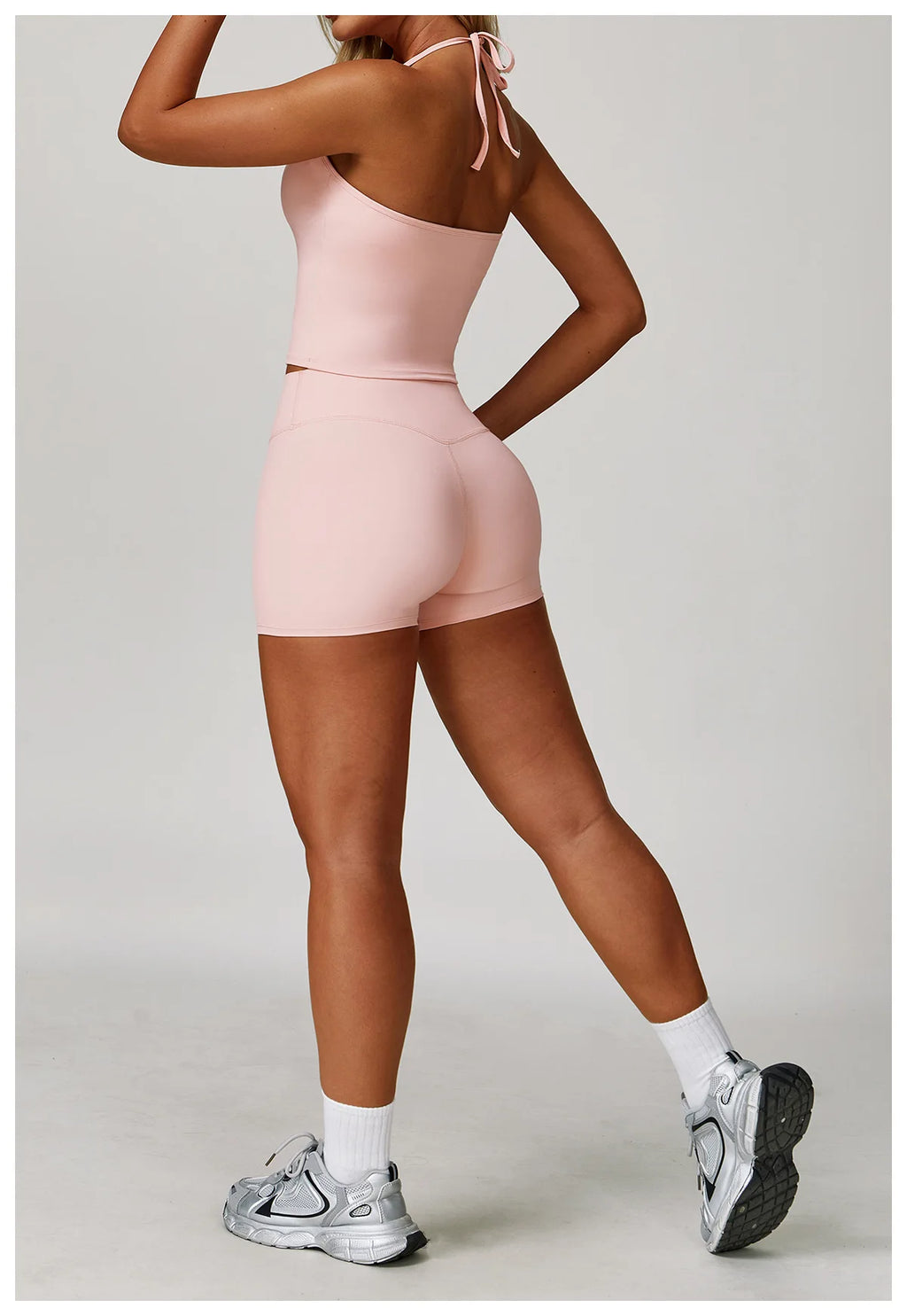 Xooie Fit women's matching activewear set in pink featuring a crop top and shorts for a stylish workout look