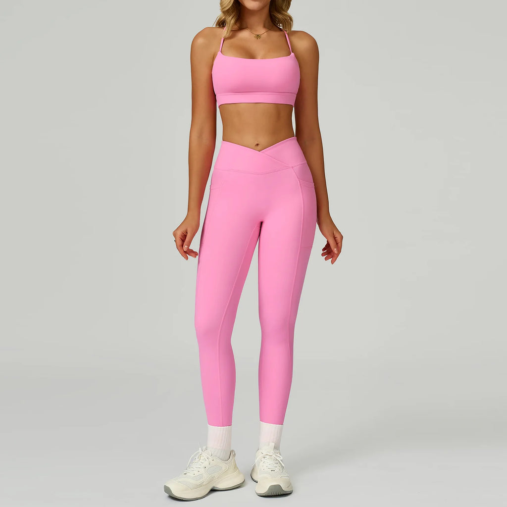 Pink sports bra and matching leggings set, smooth waistband and pockets