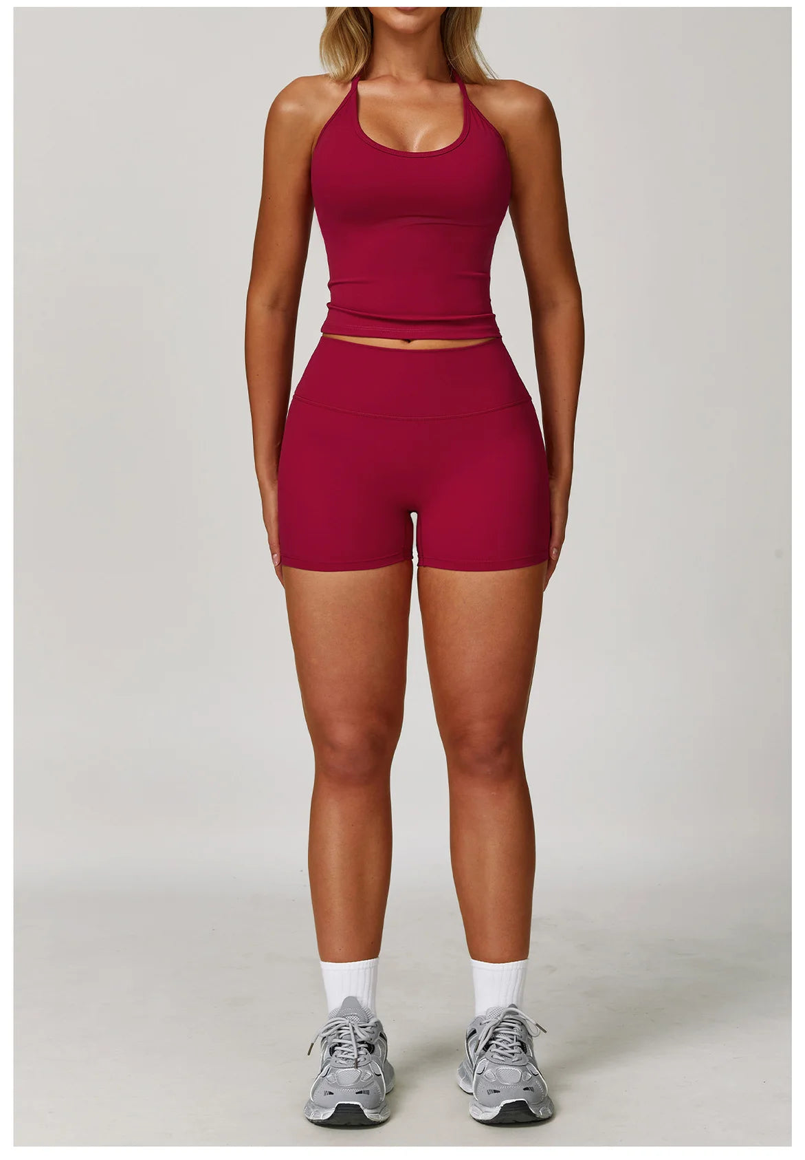 Xooie Fit women's matching activewear set featuring a fitted crop top and high-waisted shorts in burgundy