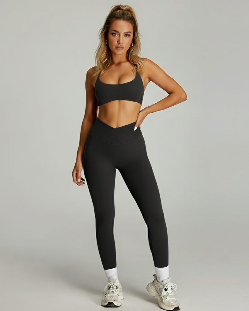 Women's matching workout set by Xooie Fit featuring a sleek sports bra and high-waisted leggings