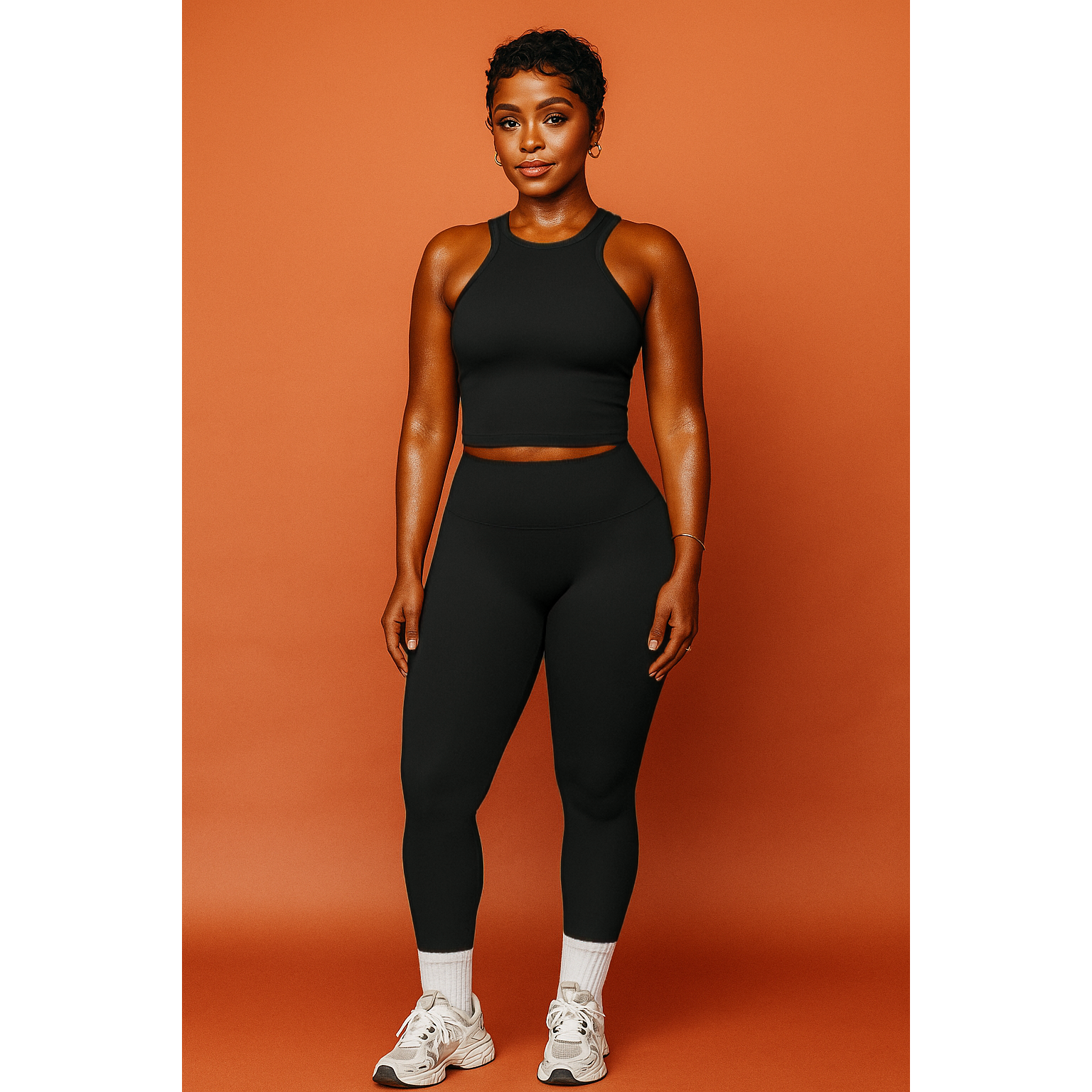 Xooie Fit women's matching workout set in black featuring a sleeveless crop top and high-waisted leggings
