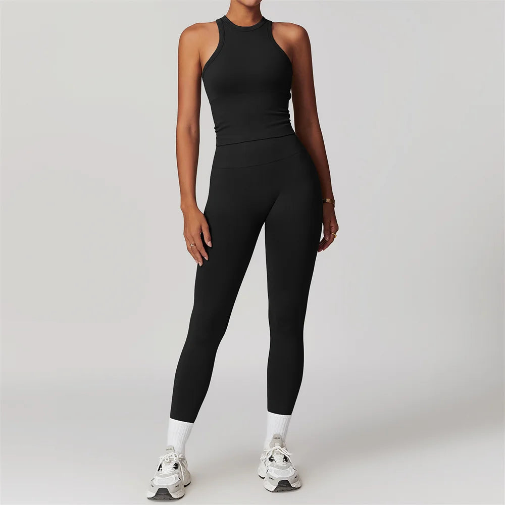 Xooie Fit women's matching workout set in black sleeveless top and high-waisted leggings