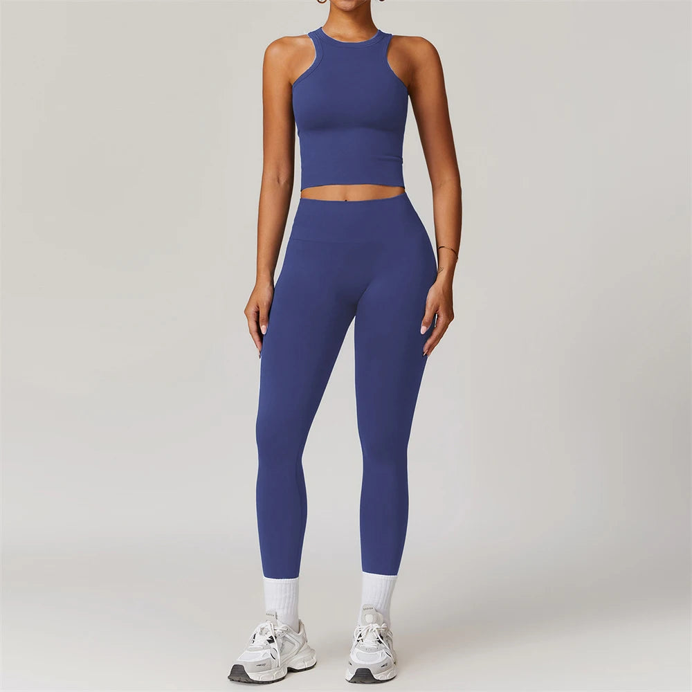 Xooie Fit women's matching workout set in blue with sleeveless crop top and high-waisted leggings