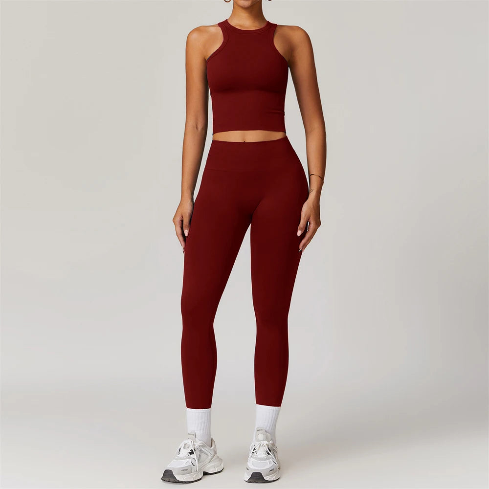 Xooie Fit women's matching workout set in deep red with sleeveless crop top and high-waisted leggings