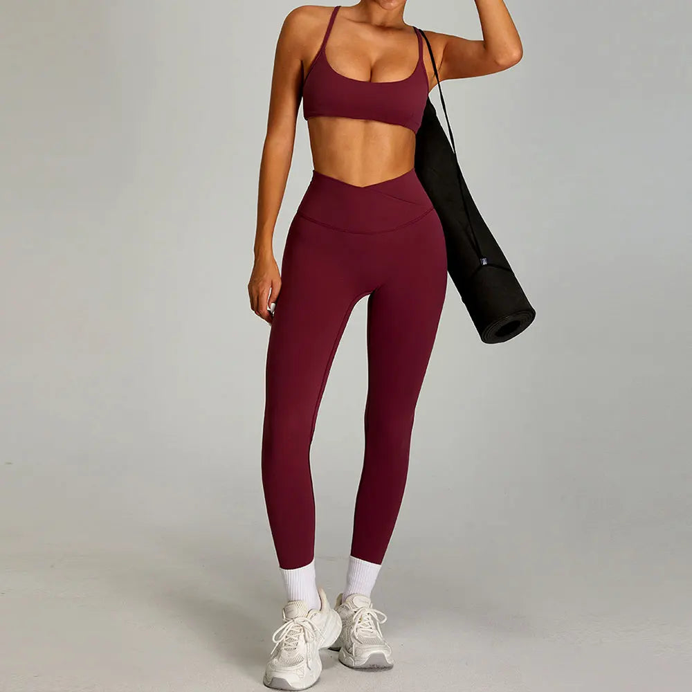 Xooie Fit women's matching workout set in burgundy featuring a crop top and high-waisted leggings