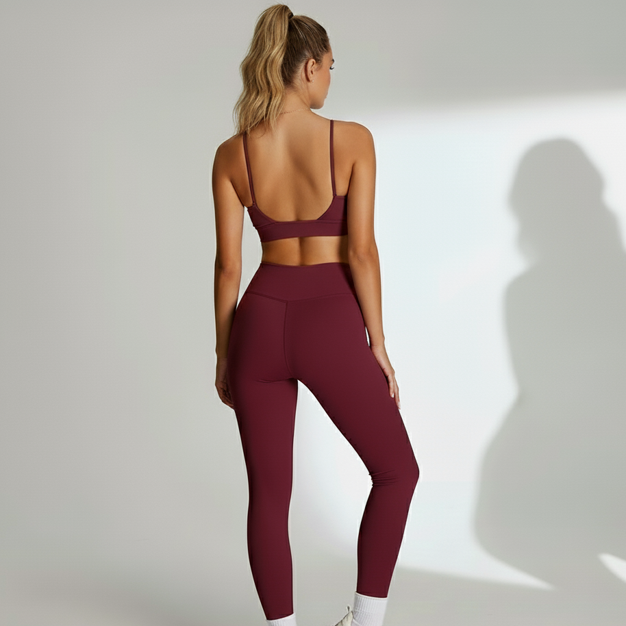 Women's matching workout set from Xooie Fit in burgundy, featuring a stylish crop top and leggings