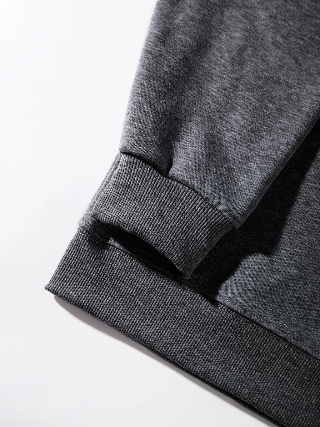 Detail of Xooie Fit women's oversized sweatshirt featuring ribbed cuffs and hem for a comfortable fit