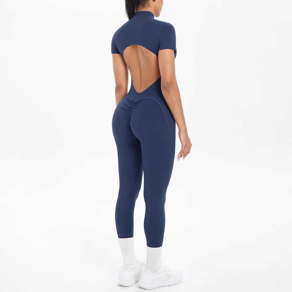 Xooie Fit women's short sleeve jumpsuit activewear in navy with a stylish cut-out back design