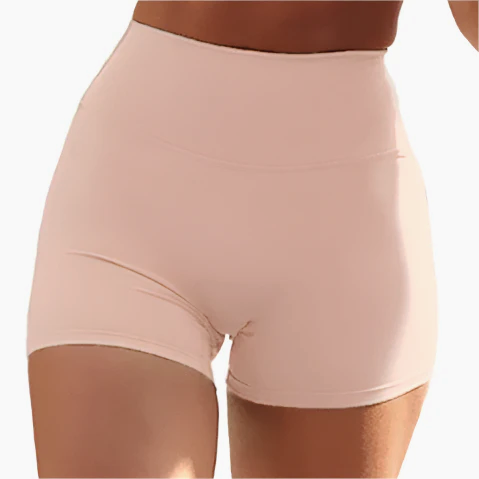 Xooie Fit women's stretchy workout shorts in soft pink color, designed for comfort and flexibility