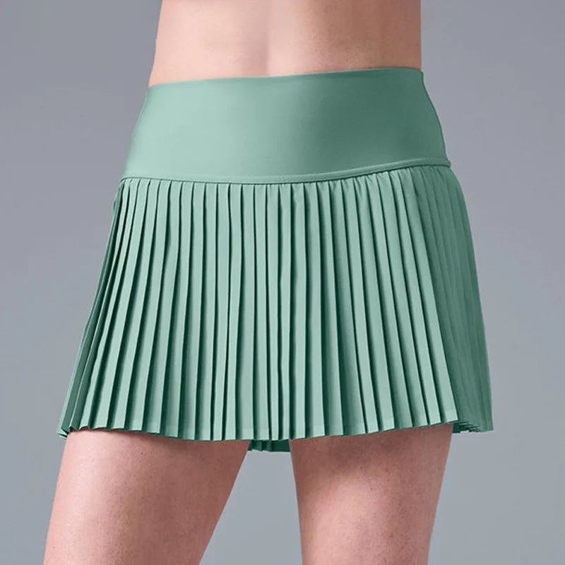 Xooie Fit women's tennis skort with phone pockets in a pleated design and a comfortable waistband