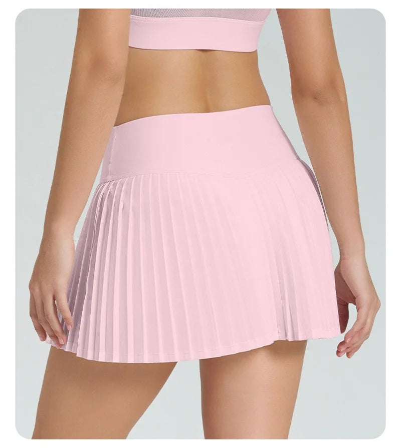 Xooie Fit Women's Tennis Skort with Phone Pockets in Soft Pink with Pleated Design