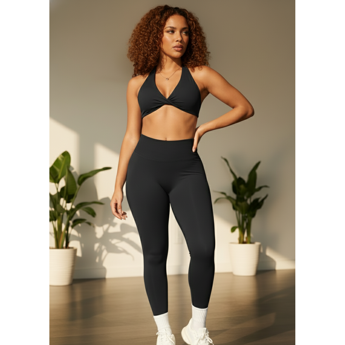 Xooie Fit women's twist bra and high waist leggings set in black for comfortable workouts