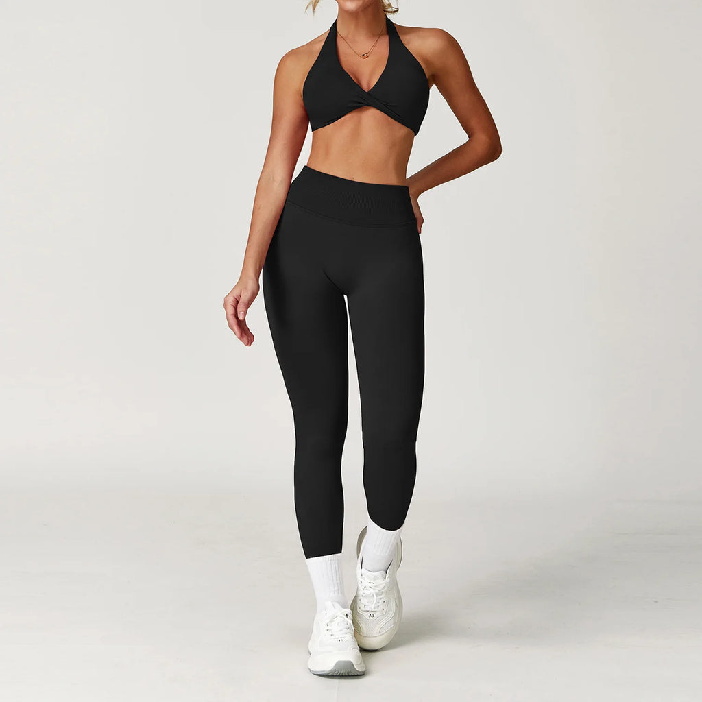 Xooie Fit women's twist bra and high waist leggings set in black, ideal for workouts and casual wear