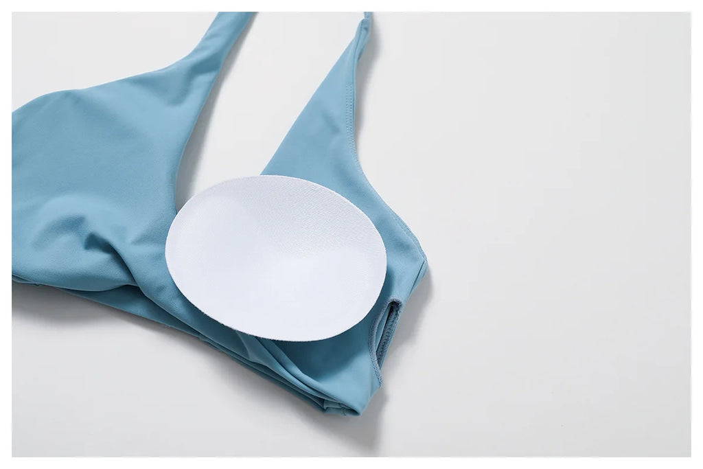 Xooie Fit women's twist bra and high waist leggings set in blue with removable padding for comfort