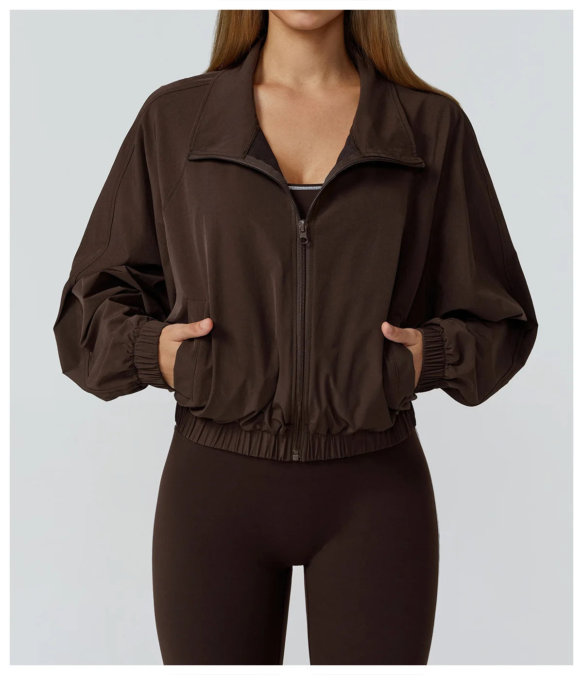 Xooie Fit women's windproof fitness jacket in brown with a cropped design and zippered front