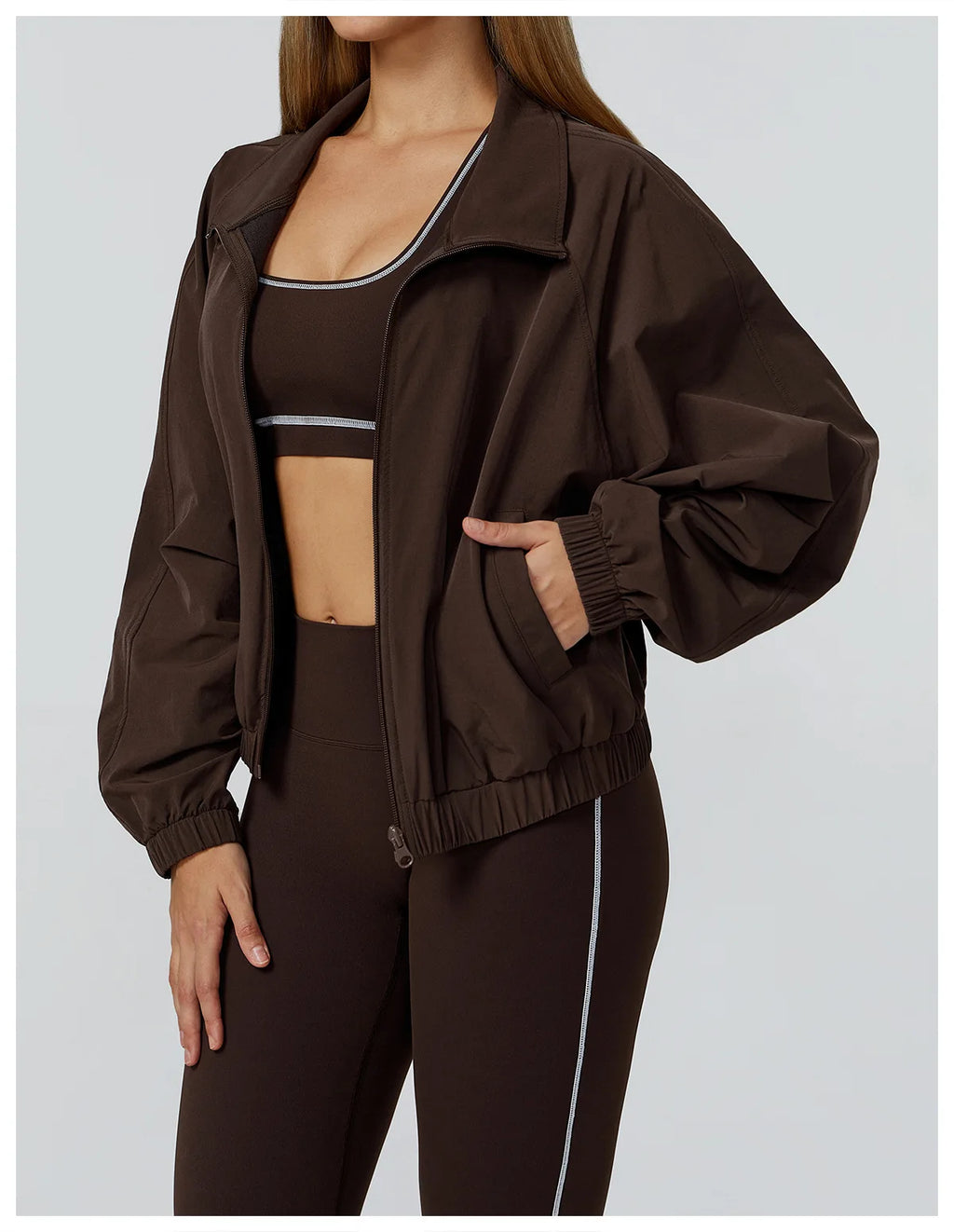 Xooie Fit women's windproof fitness jacket in brown, designed for comfort and active wear