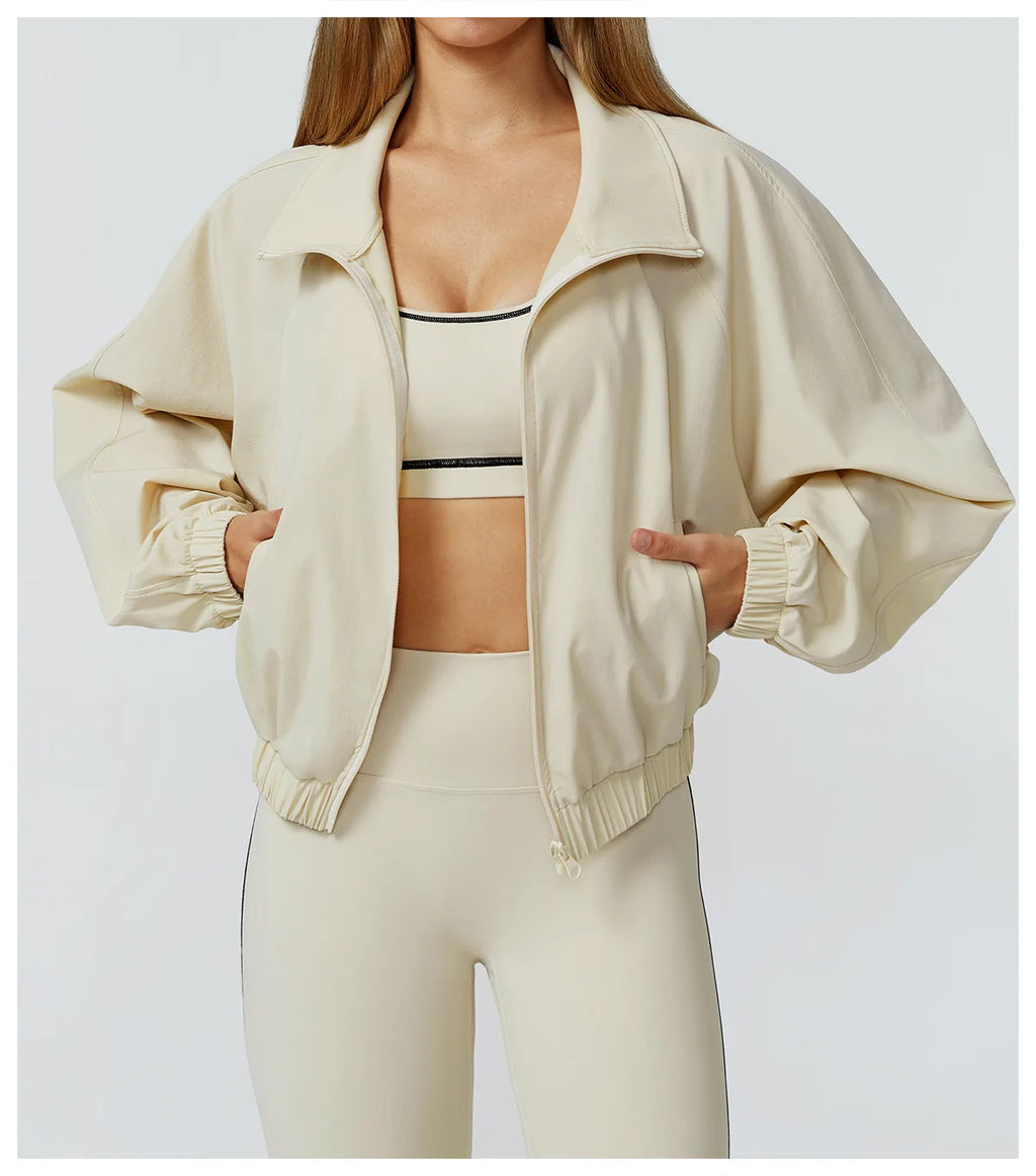 Xooie Fit women's windproof fitness jacket in beige with a relaxed fit and elastic cuffs