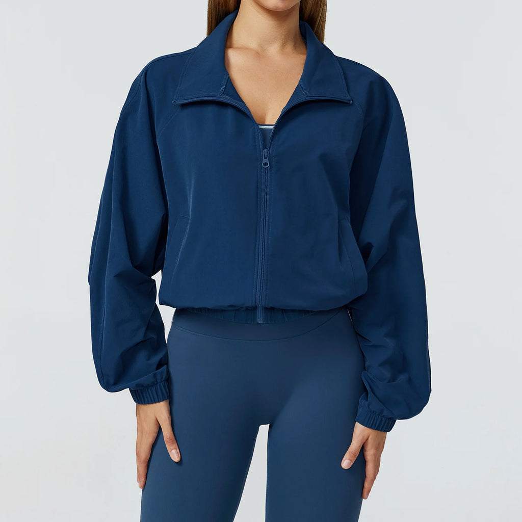 Xooie Fit women's windproof fitness jacket in navy blue with a stylish zip-up design