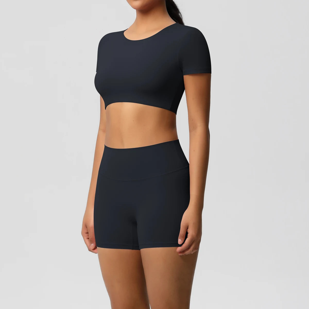 Xooie Fit women's workout crop top and shorts set in black two-piece activewear outfit