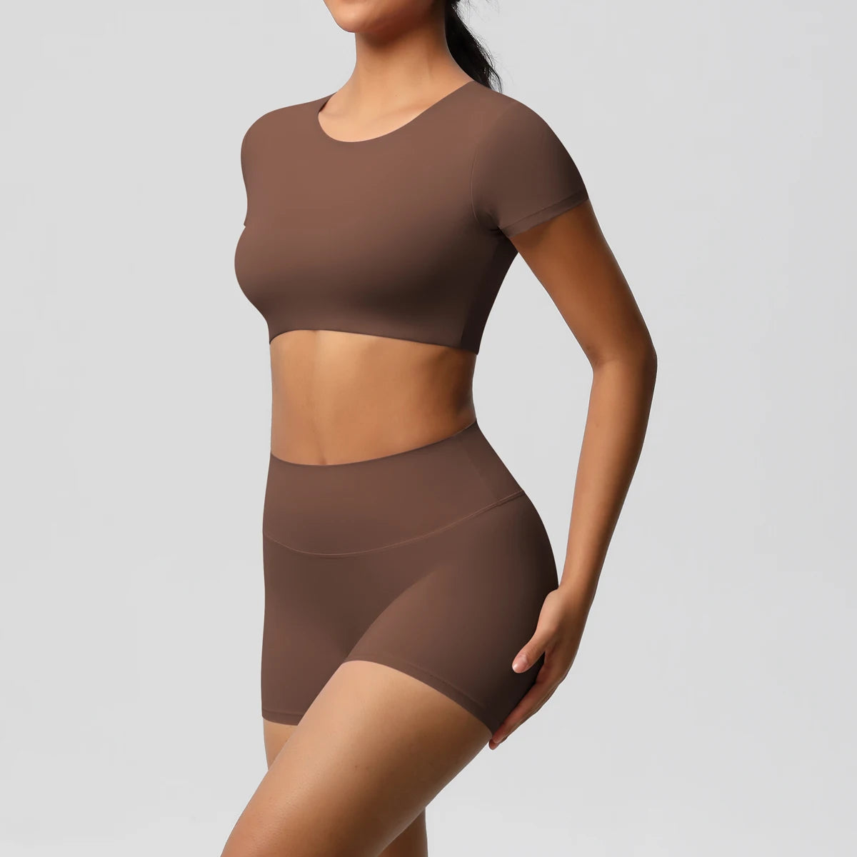 Xooie Fit women's workout crop top and shorts set in brown with seamless design