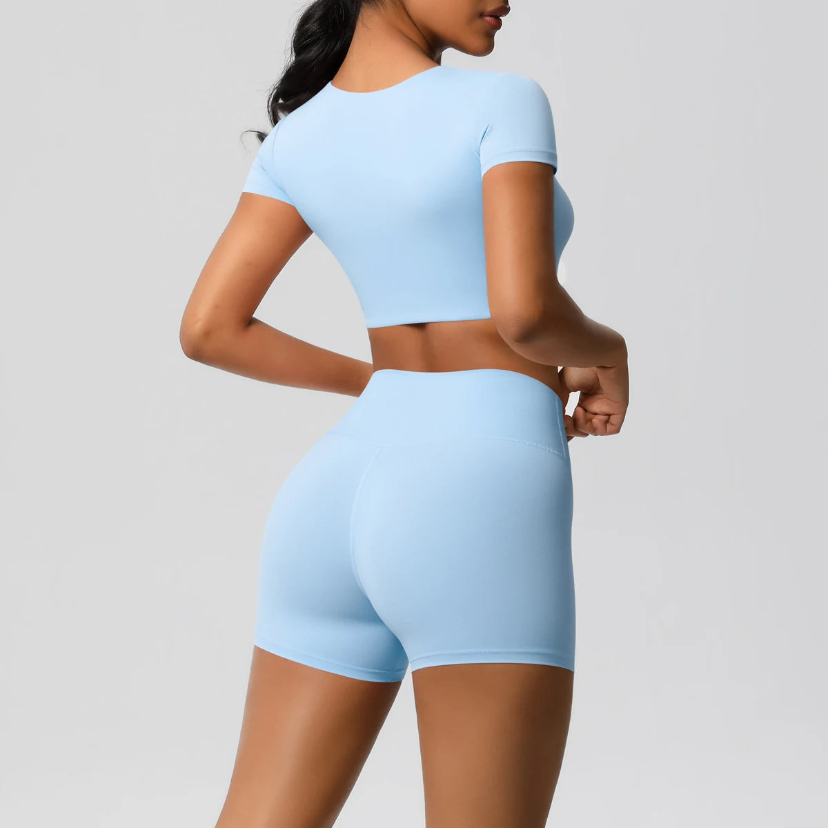Xooie Fit women's workout crop top and shorts set in light blue with short sleeves and high-waisted shorts2