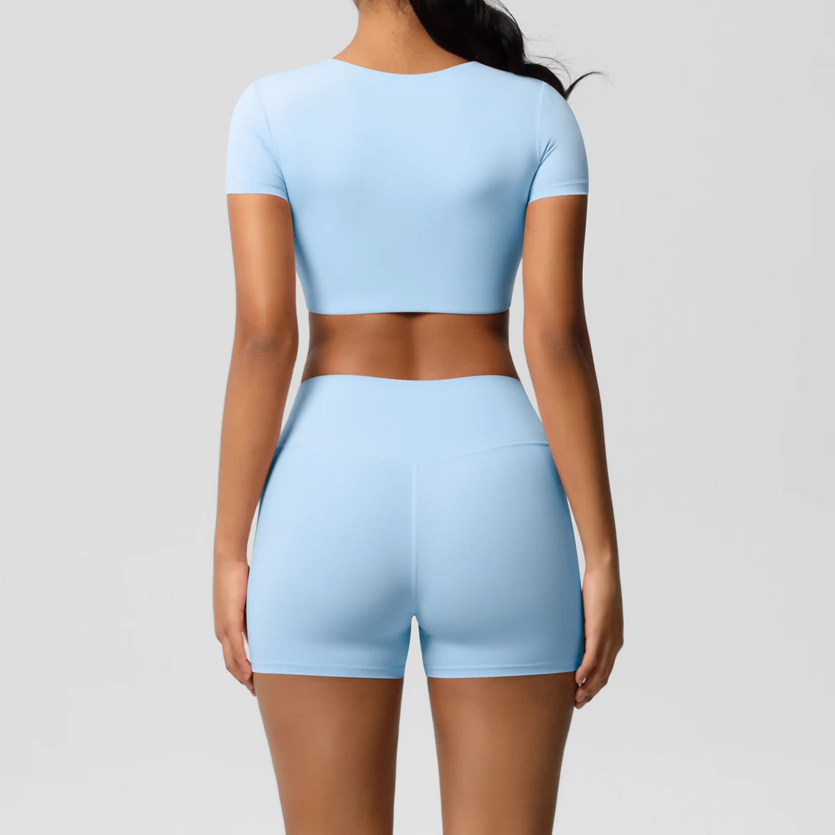 Xooie Fit women's workout crop top and shorts set in light blue with short sleeves and high-waisted shorts
