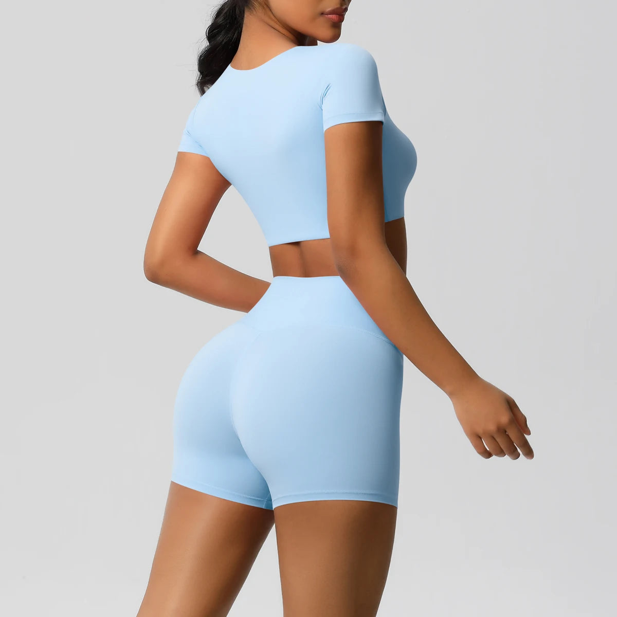 Xooie Fit women's workout crop top and shorts set in light blue with short sleeves and high-waisted shorts back