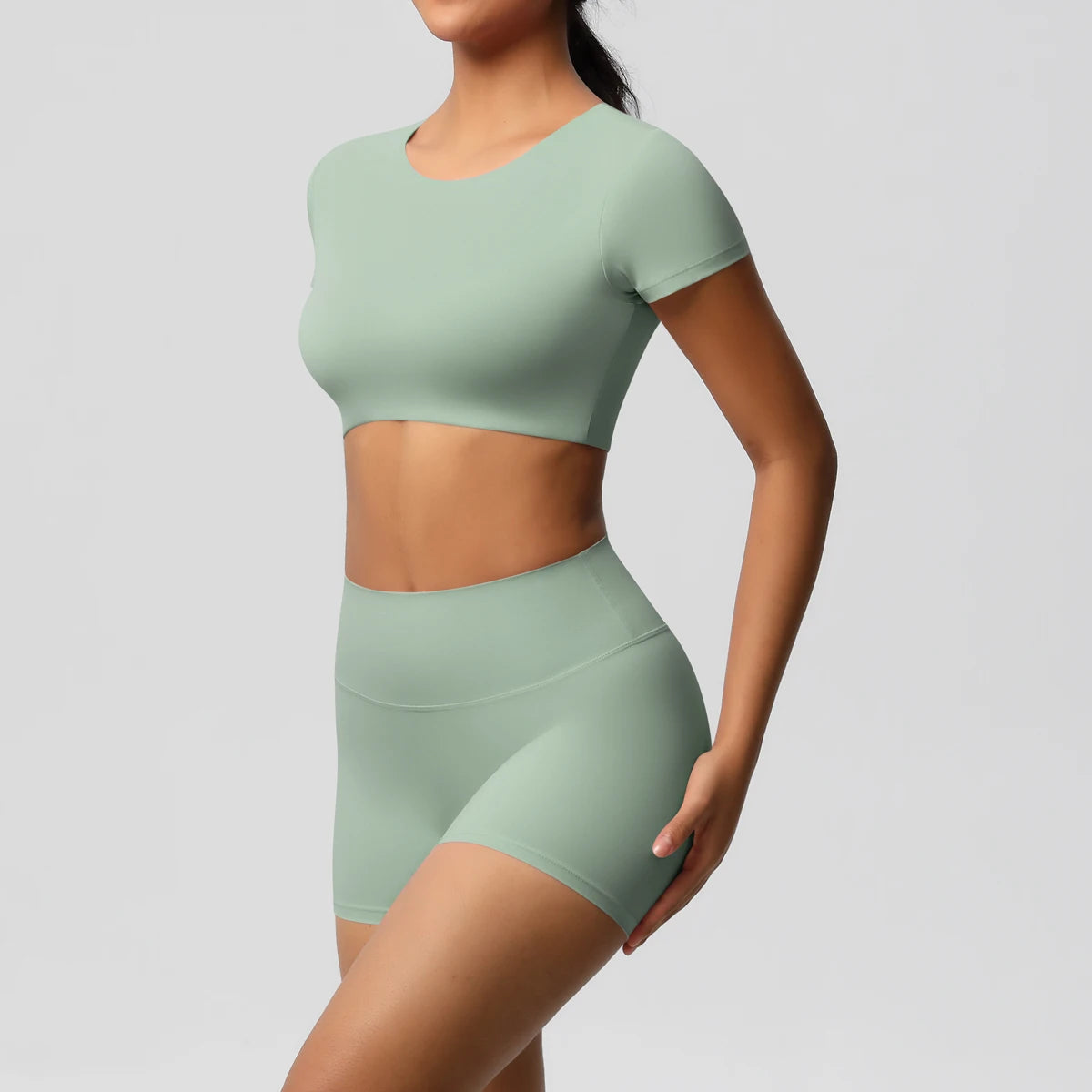 Xooie Fit women's workout crop top and shorts set in light green with short sleeves and high-waisted shorts