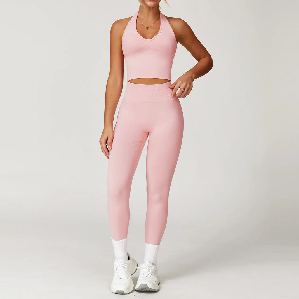 Xooie Fit pink women's workout matching set with high-waisted leggings and halter crop top