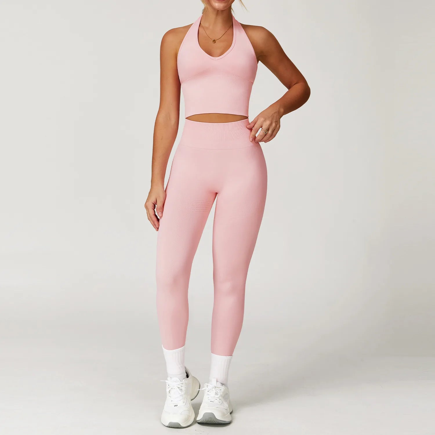 Xooie Fit pink women's workout matching set with high-waisted leggings and halter crop top