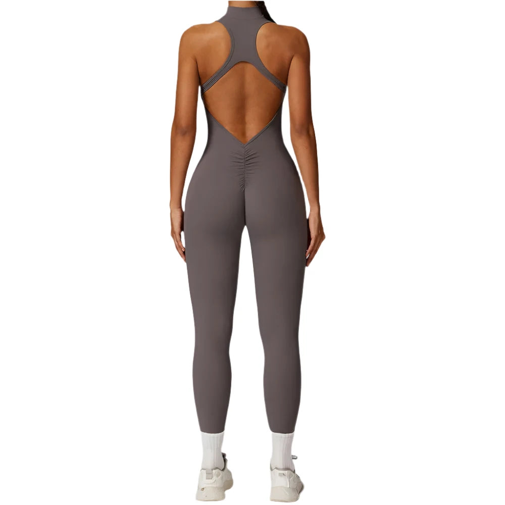 Xooie Fit women's workout onesie in gray with an open back design for comfortable movement