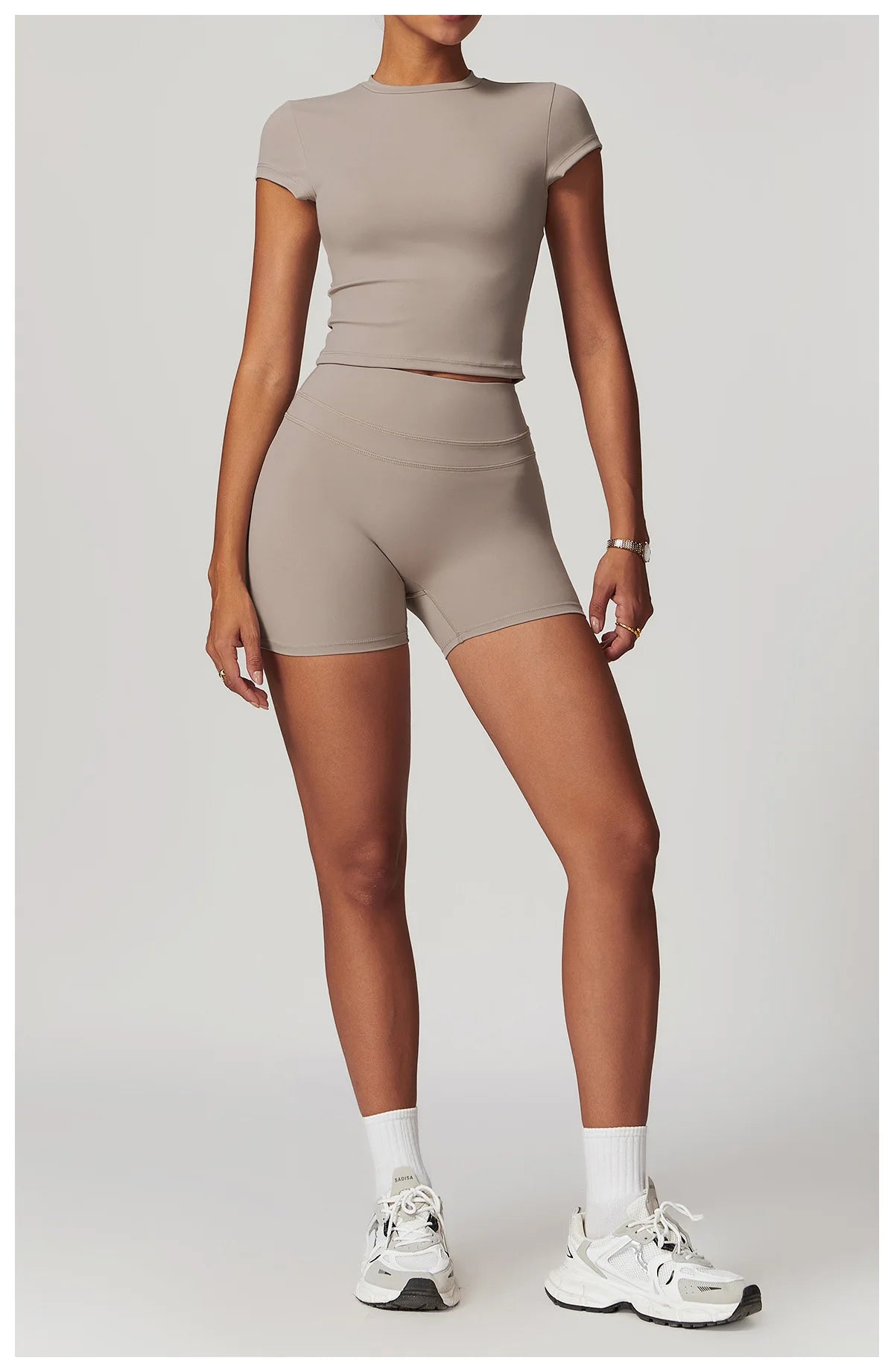 Xooie Fit womens workout set with taupe short sleeve crop top and high waist biker shorts