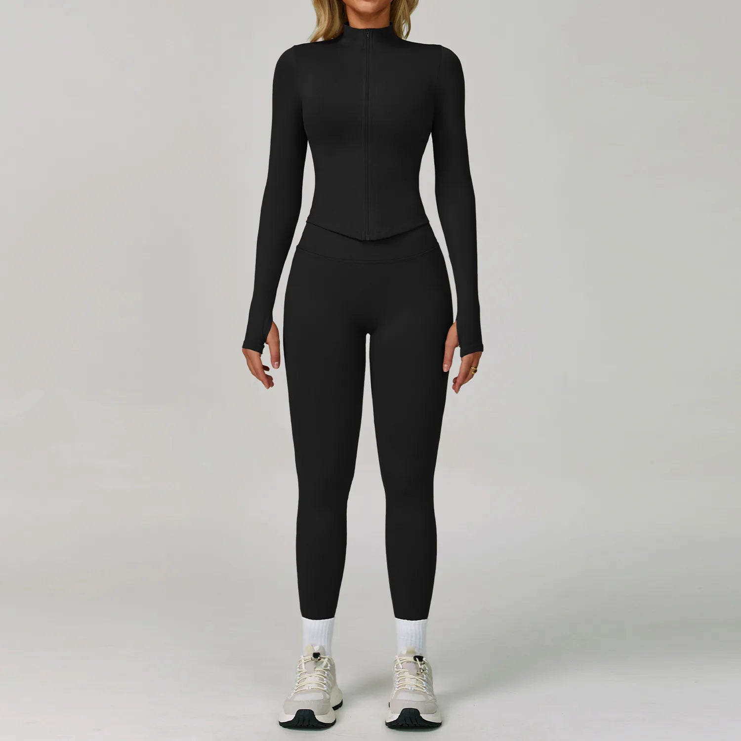 Xooie Fit women's workout set in black featuring long sleeves and fitted leggings