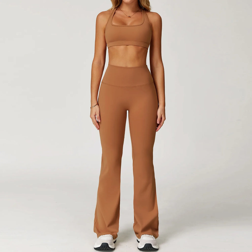Xooie Fit women's workout set flared pants in brown with matching sports bra and white sneakers
