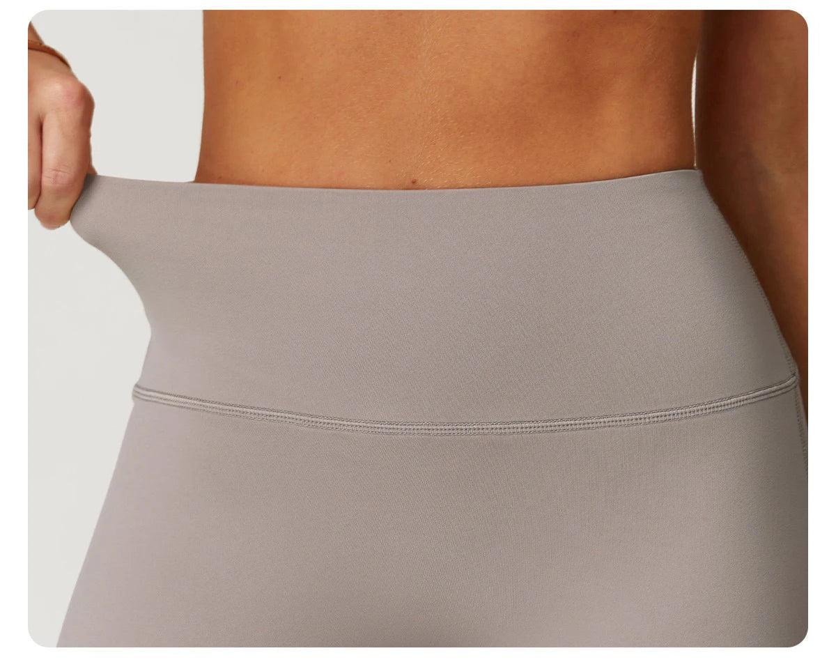 Xooie Fit women's workout set flared pants showing stretchy high waistband in light gray
